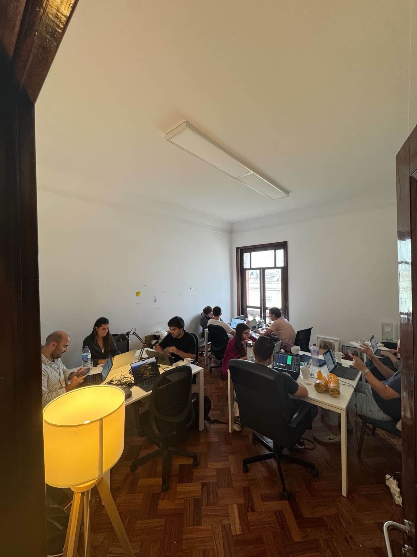 the office: desks, laptops and a wooden floor