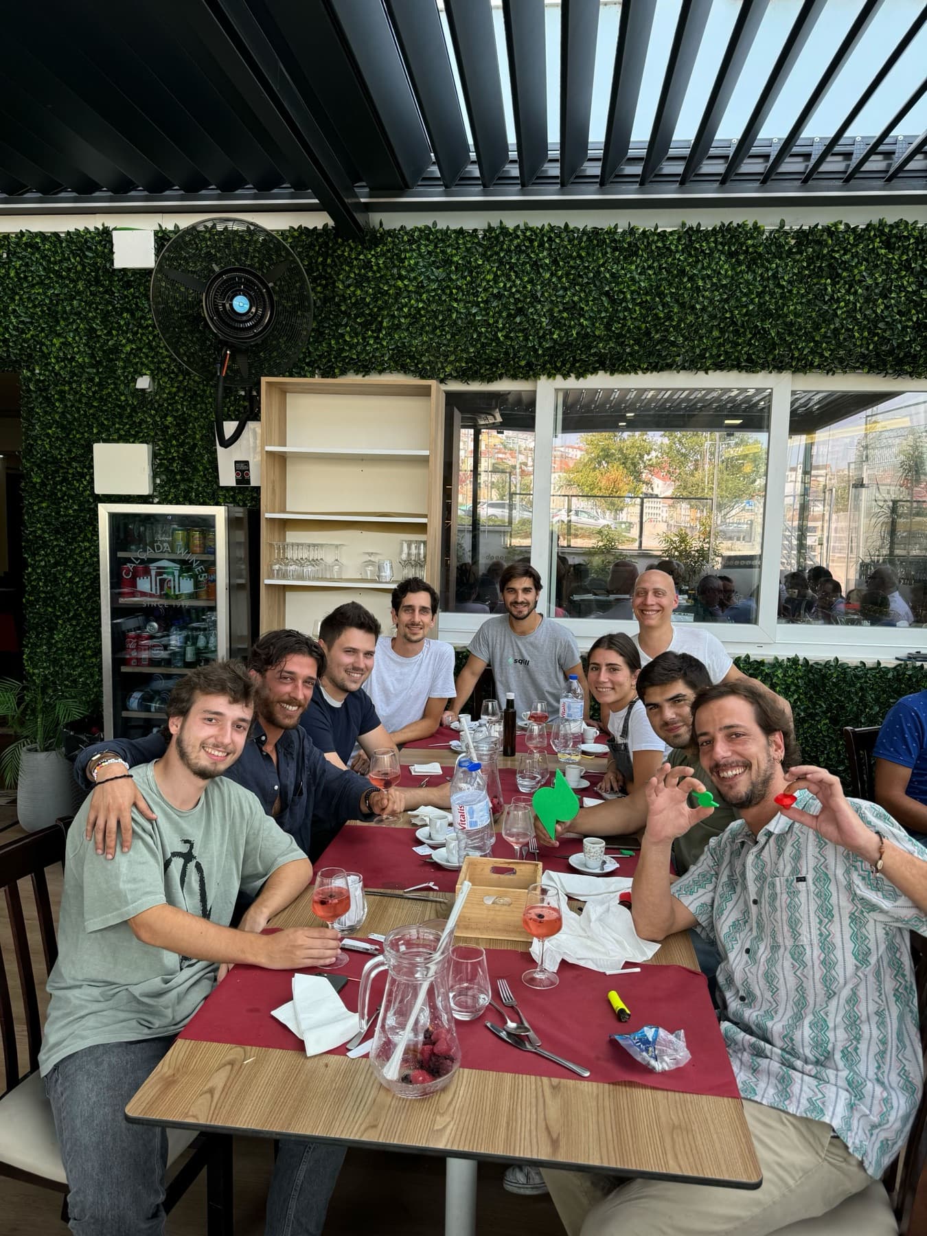 dinner outside, faces pulled at the camera